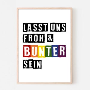 Könnte beinhalten: Ein gerahmter Druck mit dem Text "Lasst uns froh & bunter sein" in Schwarzweiß mit einem regenbogenfarbenen "bunter" in der Mitte.