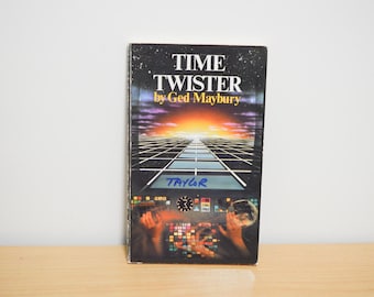 May include: A vintage paperback book titled "Time Twister" by Ged Maybury. The cover features a futuristic landscape with a grid, sunset, and a cockpit scene. The name "Taylor" is written on the cover.