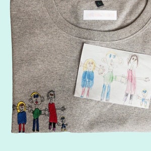 Children's drawings embroidered on shirts for big girls