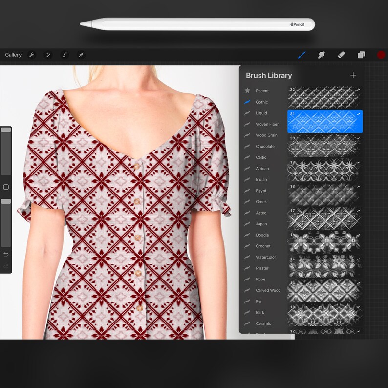 May include: A red and white patterned dress with a V-neck and short sleeves. The dress has a button closure at the front. The pattern is a repeating geometric design.