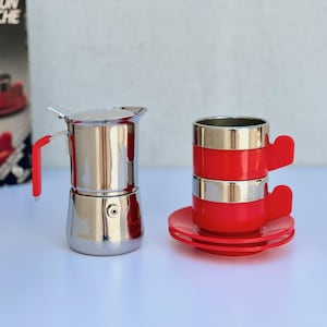 May include: A set of three ceramic vases in varying heights. The vases are white with a textured, ribbed design. The tallest vase is approximately 10 inches tall, the medium vase is 8 inches, and the smallest is 6 inches.