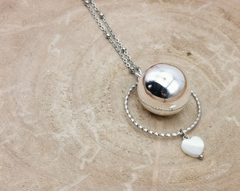 Silver pregnancy bola with ring and mother-of-pearl heart