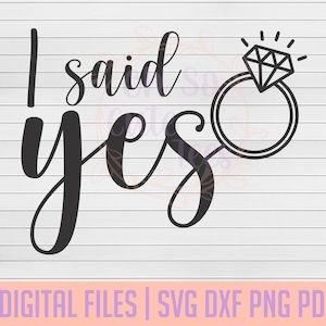 May include: Black and white graphic design with the text "I said yes" and a stylized illustration of a diamond ring.