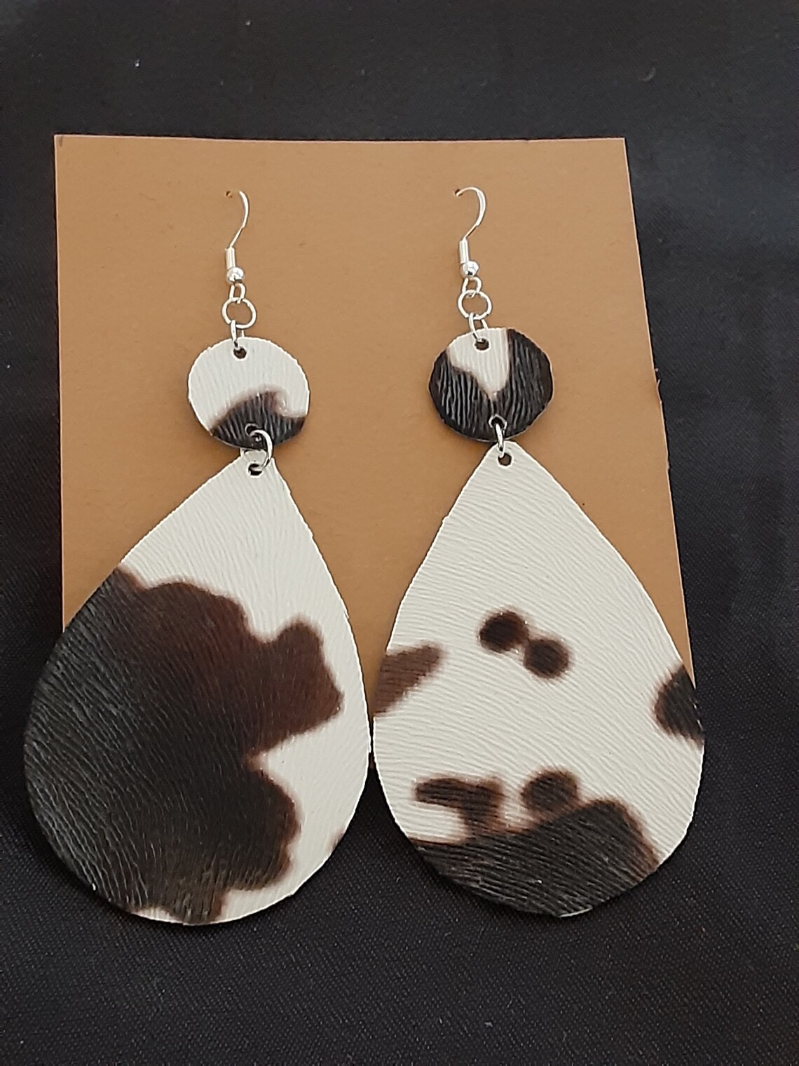 Cow print faux leather earrings. Etsy