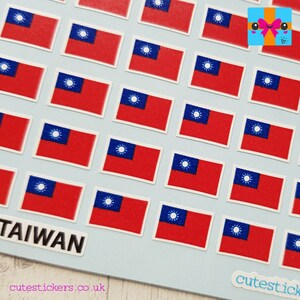 May include: A sheet of stickers featuring the flag of Taiwan. The stickers are arranged in rows and columns on a light blue background. The text "TAIWAN" is printed in black on a white rectangle at the bottom left of the sheet. The text "cutestickers.co.uk" is printed in black on a white rectangle at the bottom right of the sheet.