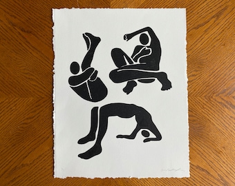 May include: Black and white print of three figures in various poses. The figures are stylized and abstract.