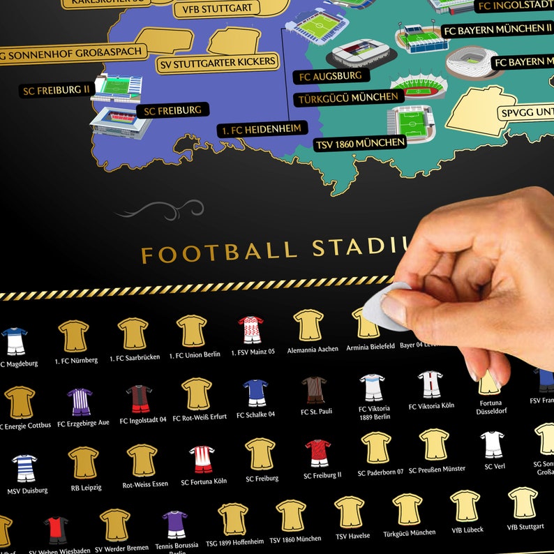 May include: A black and gold Football Stadiums scratch-off map with team jerseys and stadium illustrations. The map includes the text "FOOTBALL STADIUM". A hand is peeling off a sticker from the map.