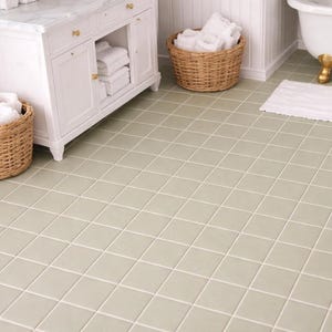 May include: A set of three ceramic mugs with a speckled, matte finish in cream, light grey, and dark grey. Each mug has a simple, minimalist design and a rounded handle.