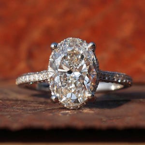 4.5 Ct Oval Lab Grown Diamond Hidden Halo White Gold Engagement Ring
