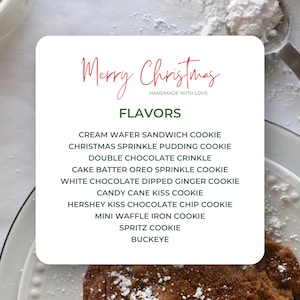 May include: A white card with the text "Merry Christmas Handmade with Love" and a list of cookie flavors: Cream Wafer Sandwich Cookie, Christmas Sprinkle Pudding Cookie, Double Chocolate Crinkle, Cake Batter Oreo Sprinkle Cookie, White Chocolate Dipped Ginger Cookie, Candy Cane Kiss Cookie, Hershey Kiss Chocolate Chip Cookie, Mini Waffle Iron Cookie, Spritz Cookie, Buckeye.