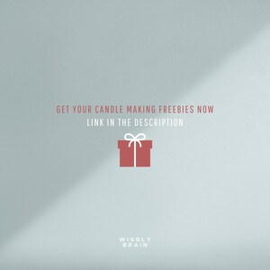 May include: A light blue background with a red gift box with a white ribbon and bow. The text "GET YOUR CANDLE MAKING FREEBIES NOW LINK IN THE DESCRIPTION" is in white text. The text "WIGGLY BRAIN" is in white text at the bottom of the image.