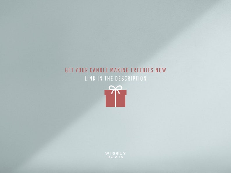 May include: A light blue background with a red gift box with a white ribbon and bow. The text "GET YOUR CANDLE MAKING FREEBIES NOW LINK IN THE DESCRIPTION" is in white text. The text "WIGGLY BRAIN" is in white text at the bottom of the image.