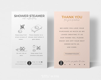 May include: Two cards with instructions for using a shower steamer and a thank you card with a discount code. The shower steamer card has black and white illustrations of how to use the steamer. The thank you card is pink with gold text and a discount code. The text on the thank you card reads "Thank you for your purchase. We hope you love your purchase as much as we loved creating it! As our thank you, please enjoy 20% off your next order with us. Use code: THANKYOU20"