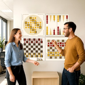 May include: Four framed game boards are displayed on a wall. The games include chess, backgammon, and two other abstract board games. The chess board has red and yellow pieces. The backgammon board has red and yellow pieces. The other two boards have yellow and red pieces.