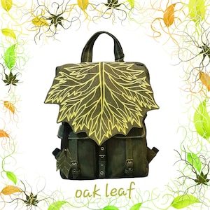 Handbag, shoulder bag or backpack in natural waterproof cork leather in military green and embroidered oak leaf flap