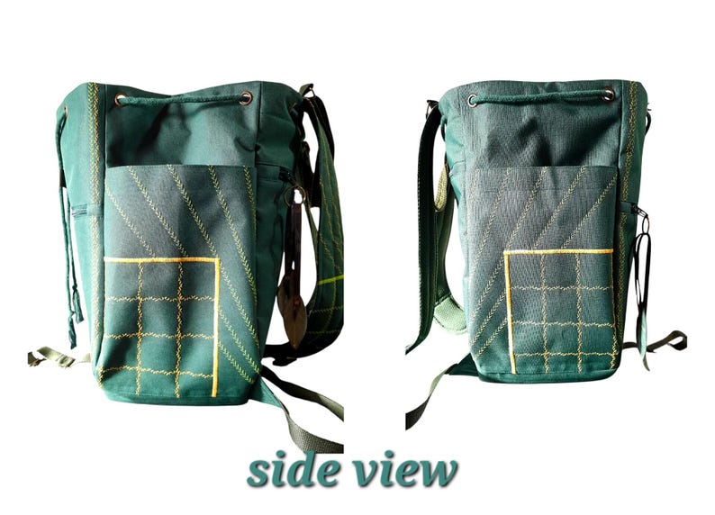 May include: A dark green canvas bucket-style backpack featuring a drawstring closure, adjustable shoulder straps, and an exterior pocket with yellow grid stitching and diagonal decorative lines. The bag includes side zippers and metal hardware.