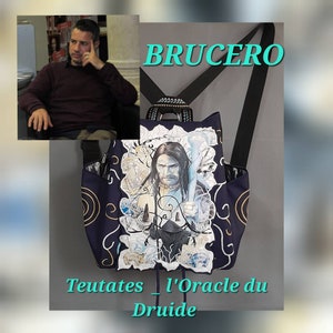 May include: A black backpack with a white and blue illustration of a man holding a staff. The backpack has a black drawstring and the text "Teutates_L'Oracle du Druide" is printed on the bottom.