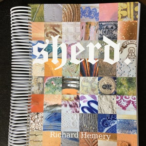 May include: A spiral-bound book titled "Sherd" with a cover featuring a mosaic of colorful, textured squares. The author's name, Richard Hemery, is printed below the title in white. The book's spine is a white spiral.