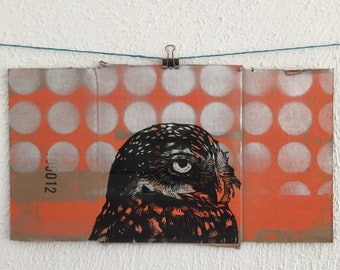 Owl linocut on cardboard packaging.
