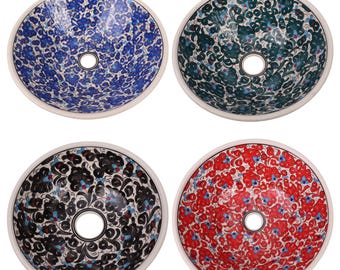 May include: Four ceramic sink bowls with intricate floral patterns. The bowls are white with blue, green, black, and red designs.