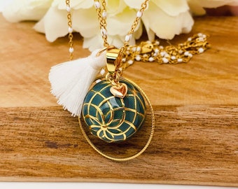 Stainless steel pregnancy bola with gold-plated copper bola ball and duck blue resin.