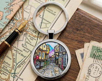 Llavero con arte de The Shambles York / Recuerdo redondo de acero inoxidable