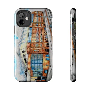 May include: A phone case featuring a detailed architectural illustration in shades of brown, orange, and blue. The design depicts a building with multiple windows and intricate details, set against a light blue and gray background.
