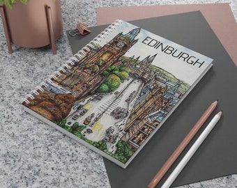 May include: A spiral bound notebook with a colorful illustration of Edinburgh, Scotland. The cover features a cityscape with buildings, streets, and trees. The title "EDINBURGH" is printed in black at the top of the cover.