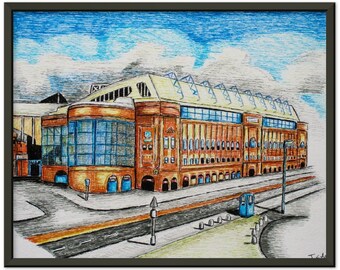 May include: A framed, hand-drawn illustration of a large brick building with a light yellow roof and blue accents. The artwork features a detailed depiction of the building's architecture, set against a blue sky with clouds. The drawing is framed in a black border.