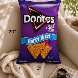 May include: A rectangular throw pillow shaped like a bag of Doritos Spicy Sweet Chili tortilla chips. The purple pillow features the Doritos logo, the text Party Size, and images of chips. It measures 20 inches in height and 12 inches in width.