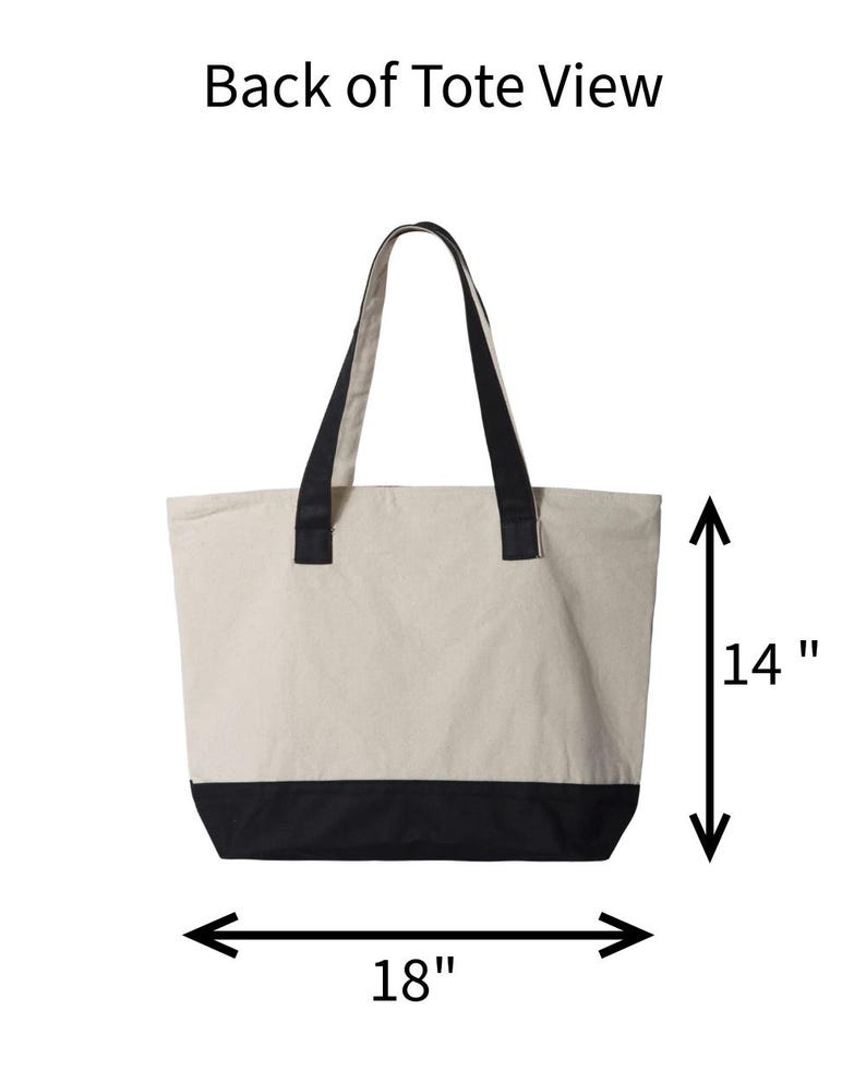 May include: Back view of a beige tote bag with black accents. The bag has black handles and a black bottom panel. The bag is 18 inches wide and 14 inches tall.
