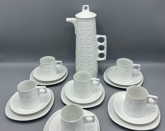 Isaac Diaz Pardo for Castro Galicia, Spain - Coffee pot with six (6) trio sets of a coffee cup, saucer and dessert plate. MCM 1960’s