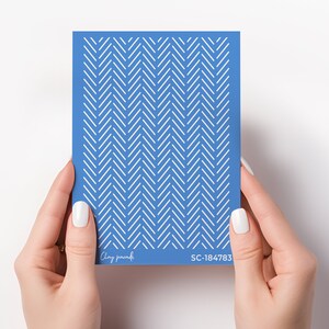 May include: A blue stencil with a white chevron pattern. The stencil is labelled "Clay paradisi" and "SC-184783".