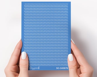May include: A blue sheet with a white chevron pattern. The sheet has the text "Clay parade" and "SC-345876" printed on it.