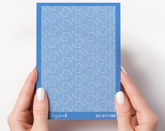 May include: A blue card with a white geometric pattern. The card has the text "Clay paradisi" and "SC-311789" printed on it.