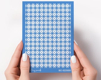 May include: A blue and white patterned stencil with the text "Clay paradise" and "SC-322555" on the bottom.