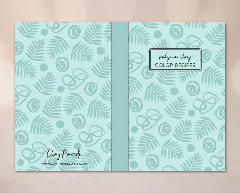 May include: A teal blue notebook with a leafy pattern and the text "polymer clay COLOR RECIPES" on the front cover. The back cover has the text "Clay Parade" and a website address.