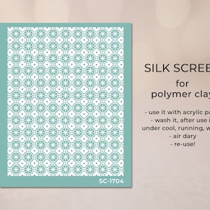 May include: A teal blue silk screen stencil with a repeating pattern of white circles and stars. The stencil is labelled "SC-1704" and is for use with polymer clay. The text "SILK SCREEN for polymer clay" is also included. Instructions for use are listed below: "use it with acrylic paint - wash it, after use it, under cool, running, water - air dry - re-use!"