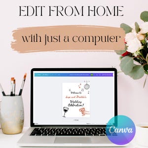May include: A laptop computer screen displaying a wedding invitation template on Canva. The invitation features a red wine glass, a disco ball, and the text "Welcome to Sage and Freddie's Wedding Celebration!"