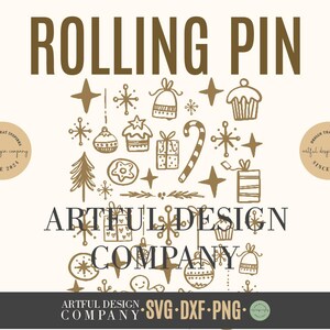 May include: A cream-coloured graphic design with the words "ROLLING PIN" in brown above festive illustrations. The design includes stars, baubles, and gift boxes. The text "ARTFUL DESIGN COMPANY" is also present, along with SVG, DXF, and PNG.