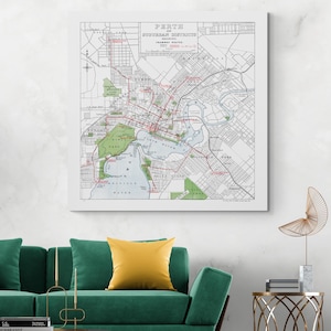 May include: A framed vintage map of Perth and suburban districts, showing tramway routes. The map features a detailed layout with red tram lines, green park areas, and blue water bodies. The title "PERTH" is at the top.