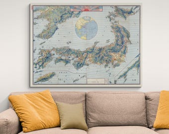 May include: A vintage map of Japan with detailed topography and coastline. The map is printed in blue, green, and brown tones on a white background. The title of the map is in Japanese characters.
