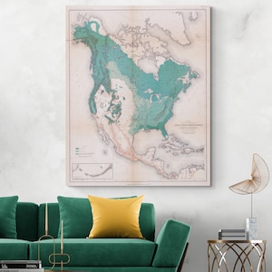 Op de afbeelding: Een vintage kaart van Noord-Amerika, met tinten turquoise en beige. De kaart toont geografische kenmerken en is ingelijst, klaar om op te hangen. De titel is zichtbaar in de rechter benedenhoek.
