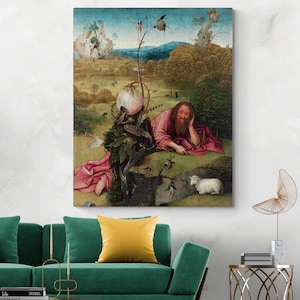 May include: A framed print of a Renaissance-style painting. The artwork depicts a man in a pink robe reclining on a grassy hill, with a white lamb nearby. The background features a landscape with trees, a pond, and a cloudy sky.