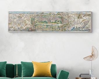 May include: A vintage map of a city, featuring detailed illustrations of buildings, streets, and waterways. The map is printed on paper and framed in a white frame.