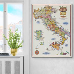 May include: A detailed vintage map of Italy, showcasing various regions and cities with colourful illustrations and text. The map is framed with a red border and includes decorative elements. The title "Vivi L'Italia" is displayed at the top of the map.
