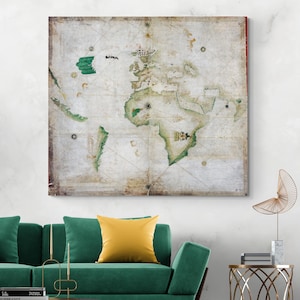 May include: A vintage-style world map canvas print. The map features continents in green and brown hues against a cream-colored background. The canvas is framed and mounted on a wall above a green sofa with a yellow pillow.
