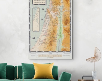 May include: A vintage-style map of Palestine during the Crusades. The map is printed on paper and features a detailed depiction of the region with various cities, towns, and geographical features labelled in English. The map is framed and displayed on a wall.