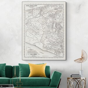 May include: A framed vintage map of Hope Ranch Park in Santa Barbara, California. The map is in black and white, with detailed streets, landmarks, and the coastline. The text "H.G. Chase Real Estate" is visible at the bottom.