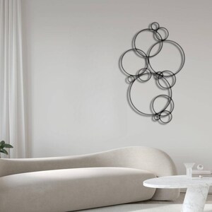 Image showcasing Abstract Bubbles Vertical Metal Wall Art, Round White Metal Wall ...
